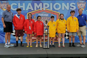 Bella Siddle, middle in the red jacket, poses with the five other division winners after the 83rd All-American Soap Box Derby, in Akron, Ohio, on Saturday, July 24, 2021.