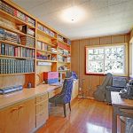 The office with built in cabinetry and original wood floors.