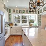 Huge kitchen island with durable Quartz counters and stainless appliances.