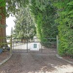 Tree lined gated entry 