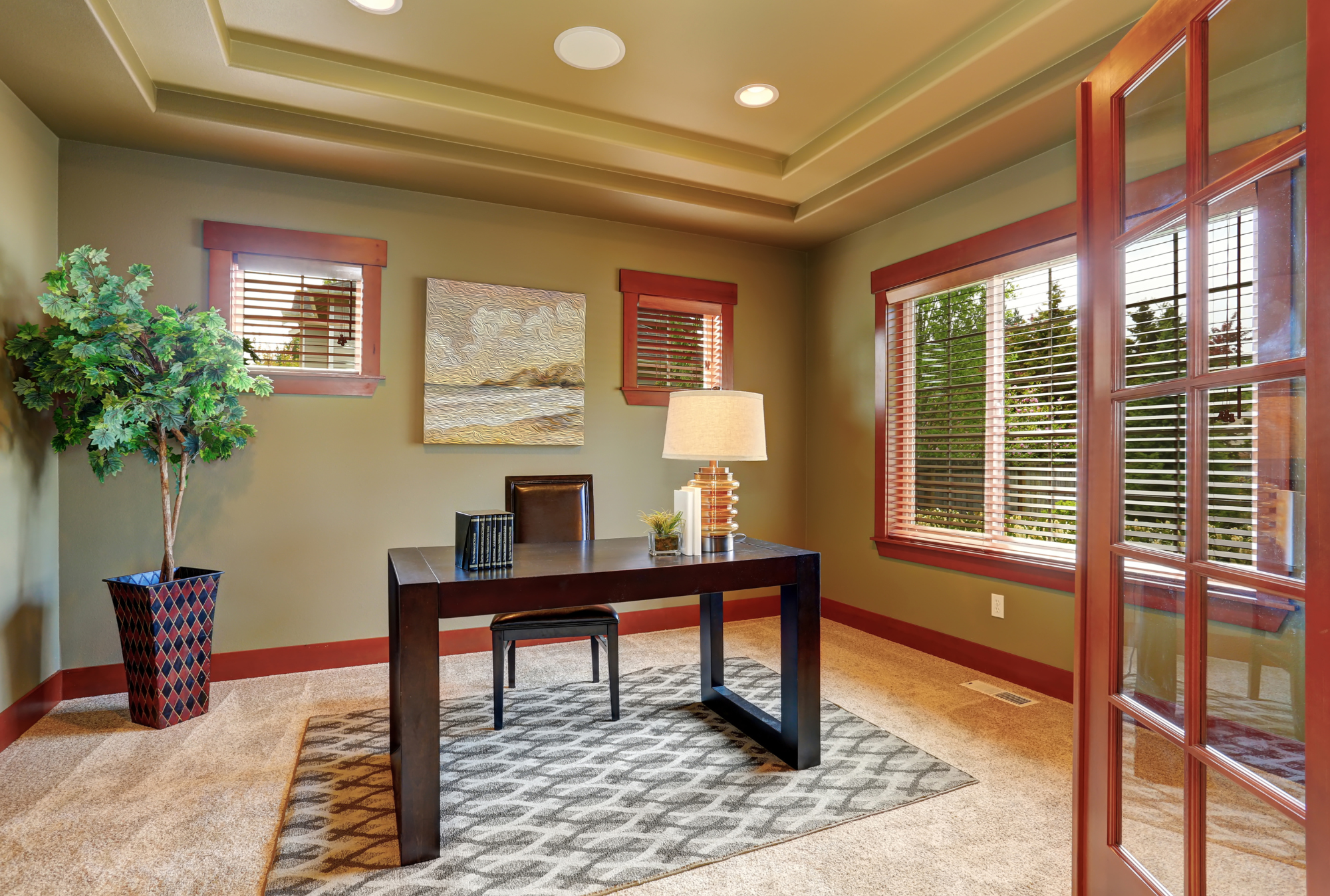 Warm colored den | Windermere Real Estate