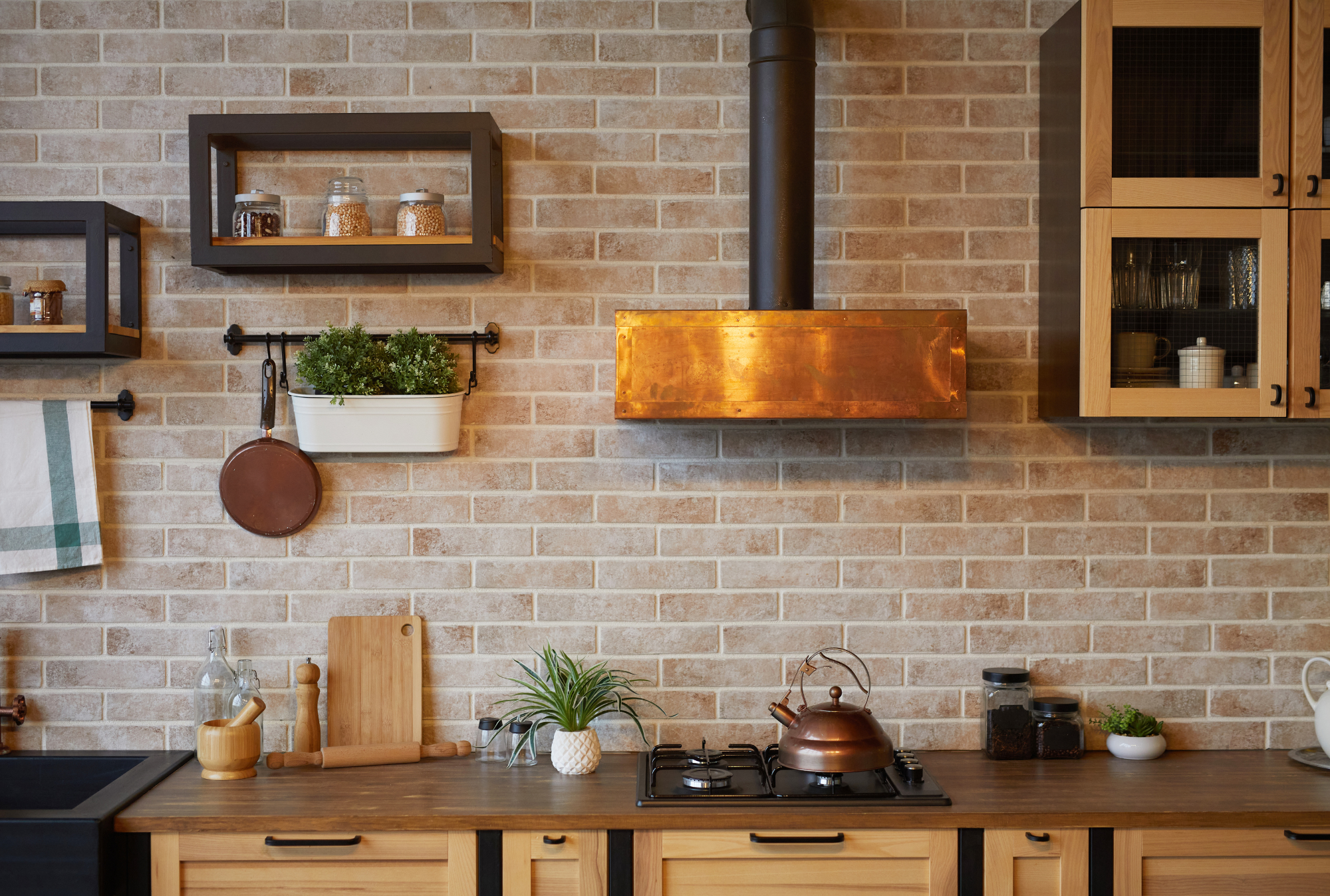 Warm brick kitchen backsplash | Windermere Real Estate