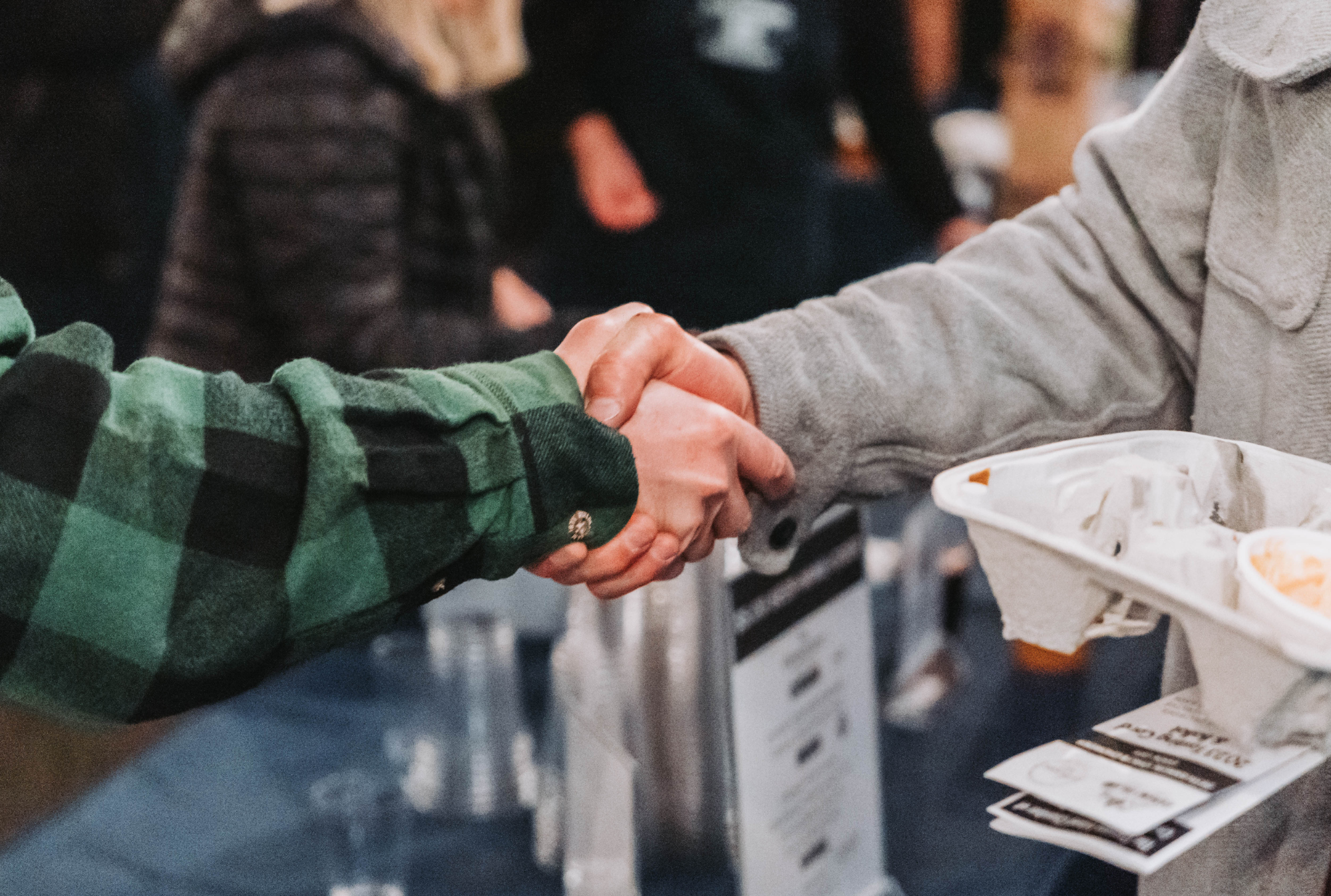 Handshakes at Chili Chowder Cook-off 2023 | Windermere Real Estate