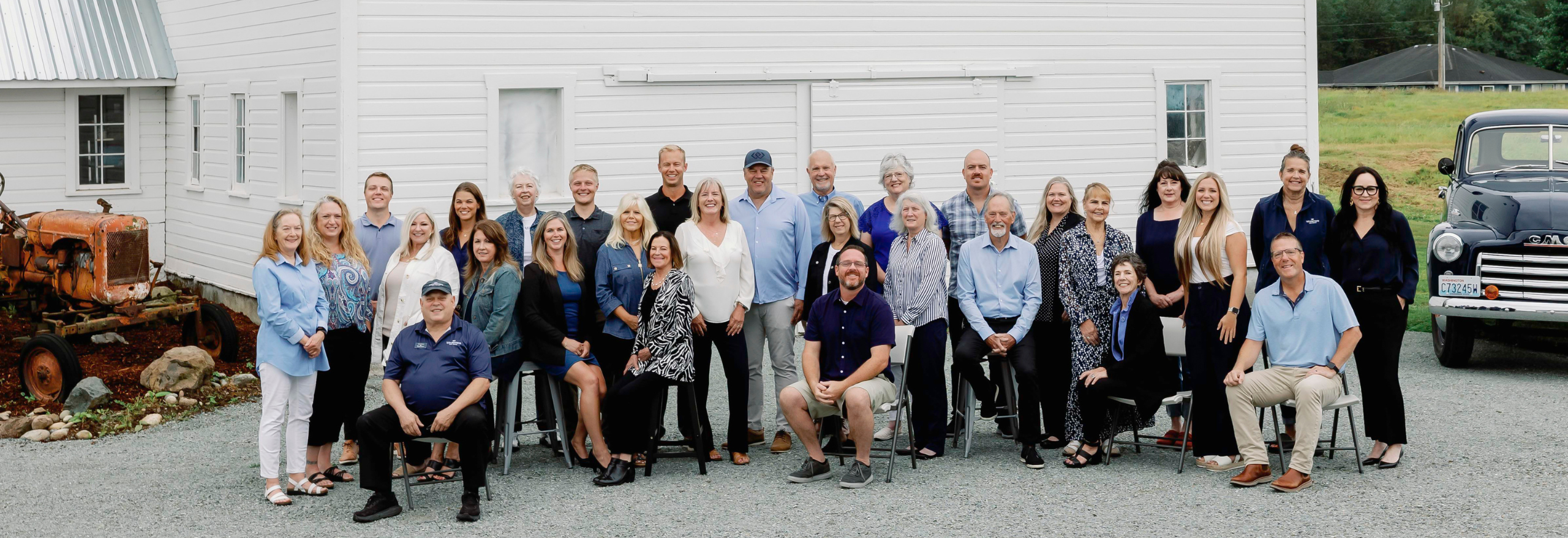 Windermere team photo in front of barn | Windermere Real Estate