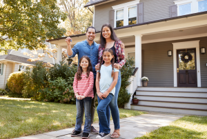 Family in front of home | Windermere Real Estate