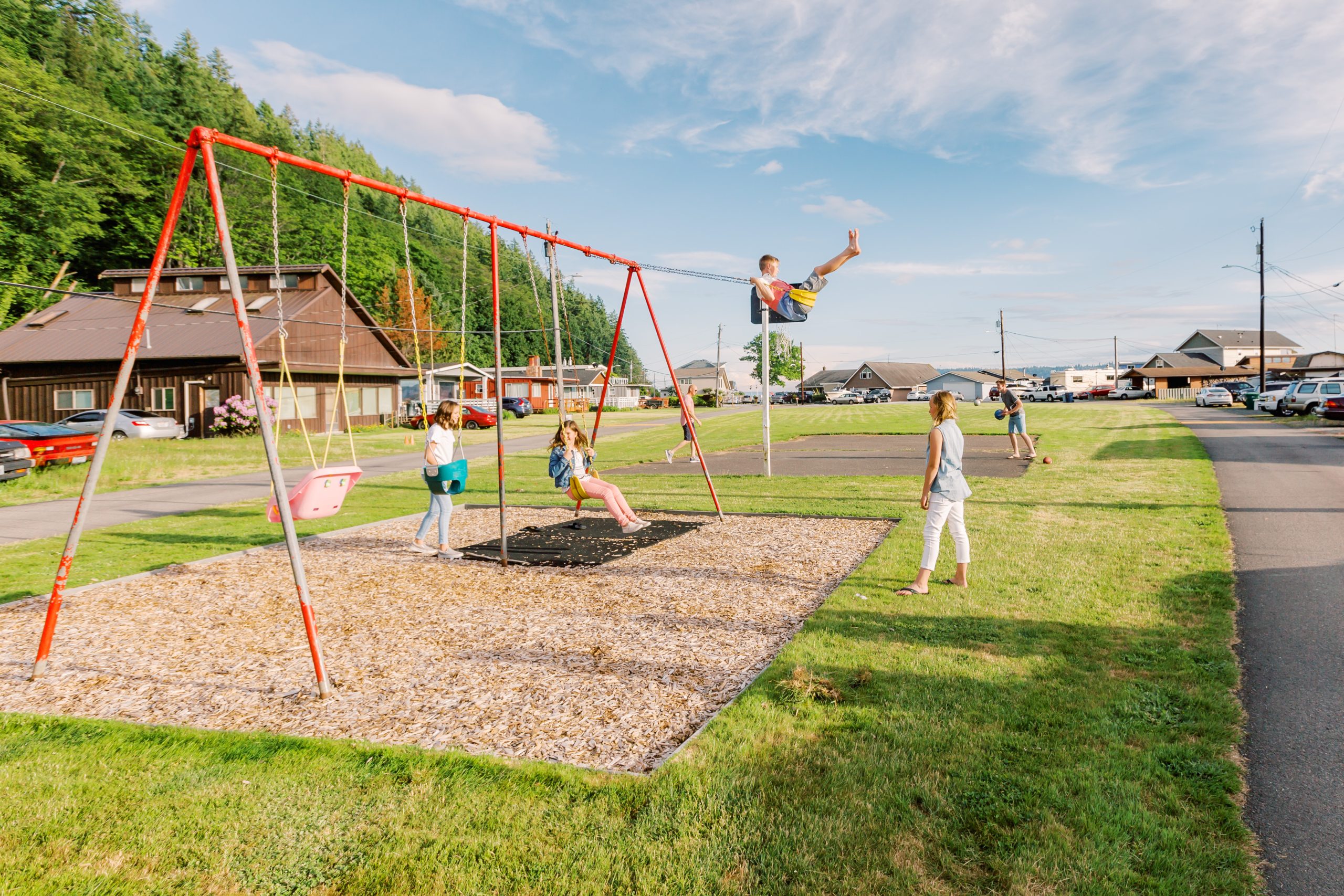 Kids playing on swings | Windermere Real Estate | Stanwood WA
