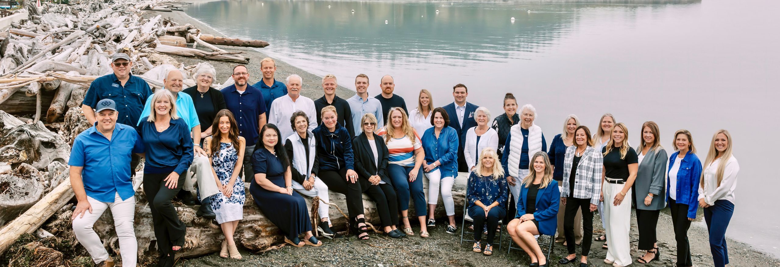 Windermere team photo on beach | Windermere Real Estate